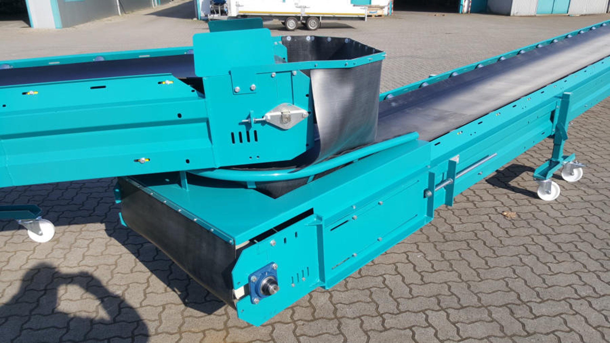Turquoise mobile conveyor with feed hopper