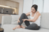 Woman holding calf in pain, illustrating plantar fasciitis discomfort.