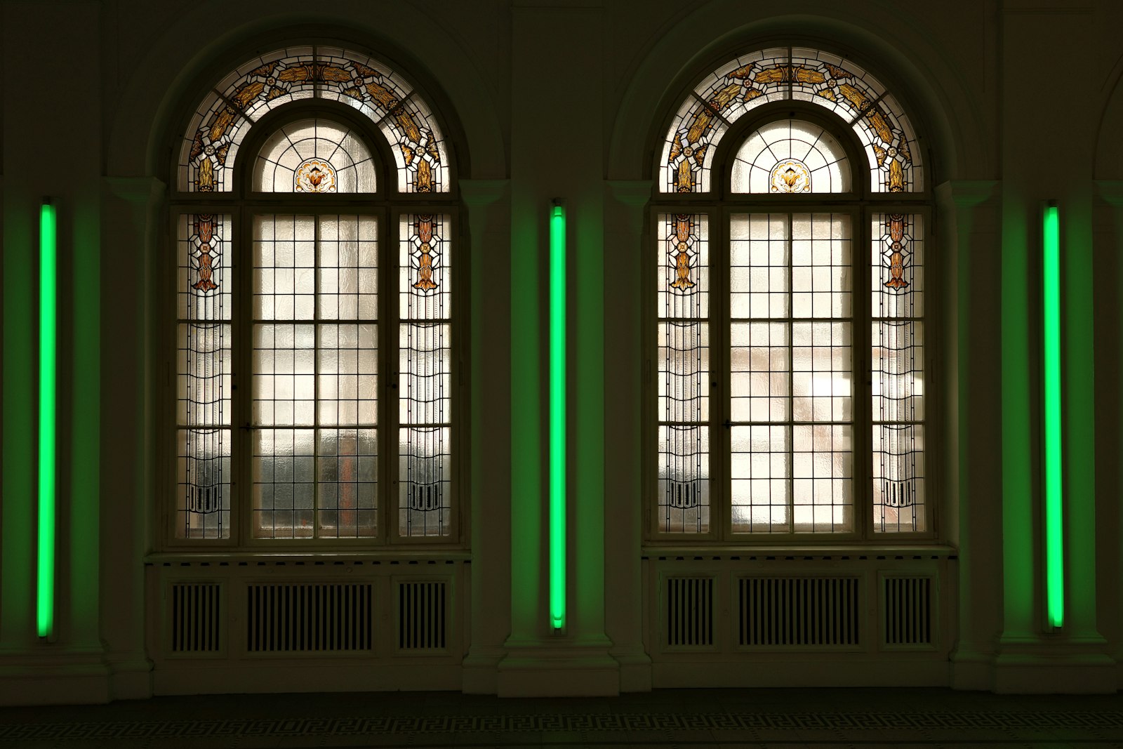 Arched specialty shape window above a picture unit
