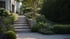 Moderne Außentreppe aus Stein führt durch einen gepflegten Garten mit Hortensien, Gräsern, Stützmauer und Bäumen zum Haus.