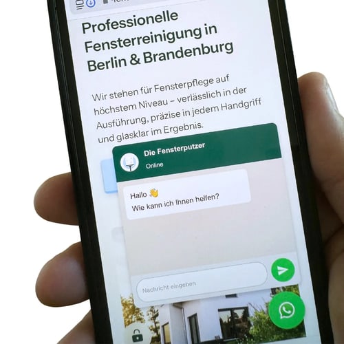 Smartphone mit WhatsApp Chat der Fensterputzer Berlin