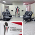 Black spinal decompression tables at Jernigan Chiropractic & Rehab medical office with logo featuring a stylized spine.