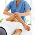 Physical therapist providing hands-on joint rehabilitation treatment