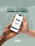 Zwei Hände halten ein Smartphone mit der DOGabout App vor dem Text „Bereit für deinen Hunde-Oktober?“.