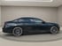 Dunkelgrauer BMW 7er Limousine der siebten Generation, von der Seite auf einem hellgrauen Drehpodest.