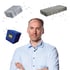 Man in a light blue shirt with two gray pavers and a blue block with yellow "m" floating around him.