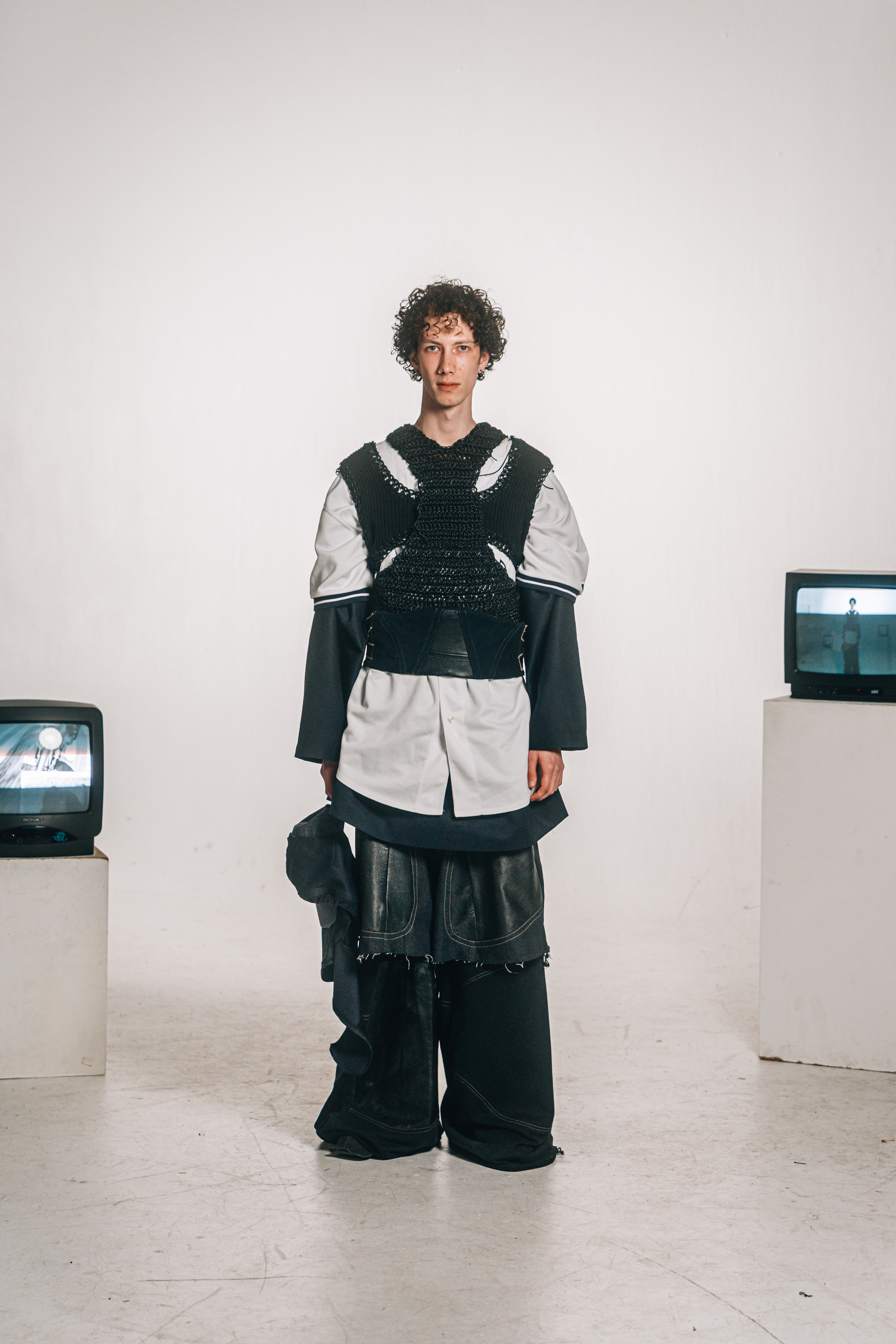 Double-layered trousers with layered jersey construction with deconstructed vest element