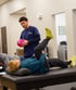 Physical therapist talking with a senior patient during Auto injury rehab. 