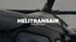 Nahaufnahme eines schwarzen Hubschraubers mit der Aufschrift „HELITRANSAIR IMAGEFILM“ und „HELITRANS AIR“.