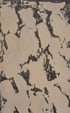 Abstrakte Textur mit unregelmäßigen schwarzen Flecken auf beigem Hintergrund, die an eine verwitterte Wand erinnern.