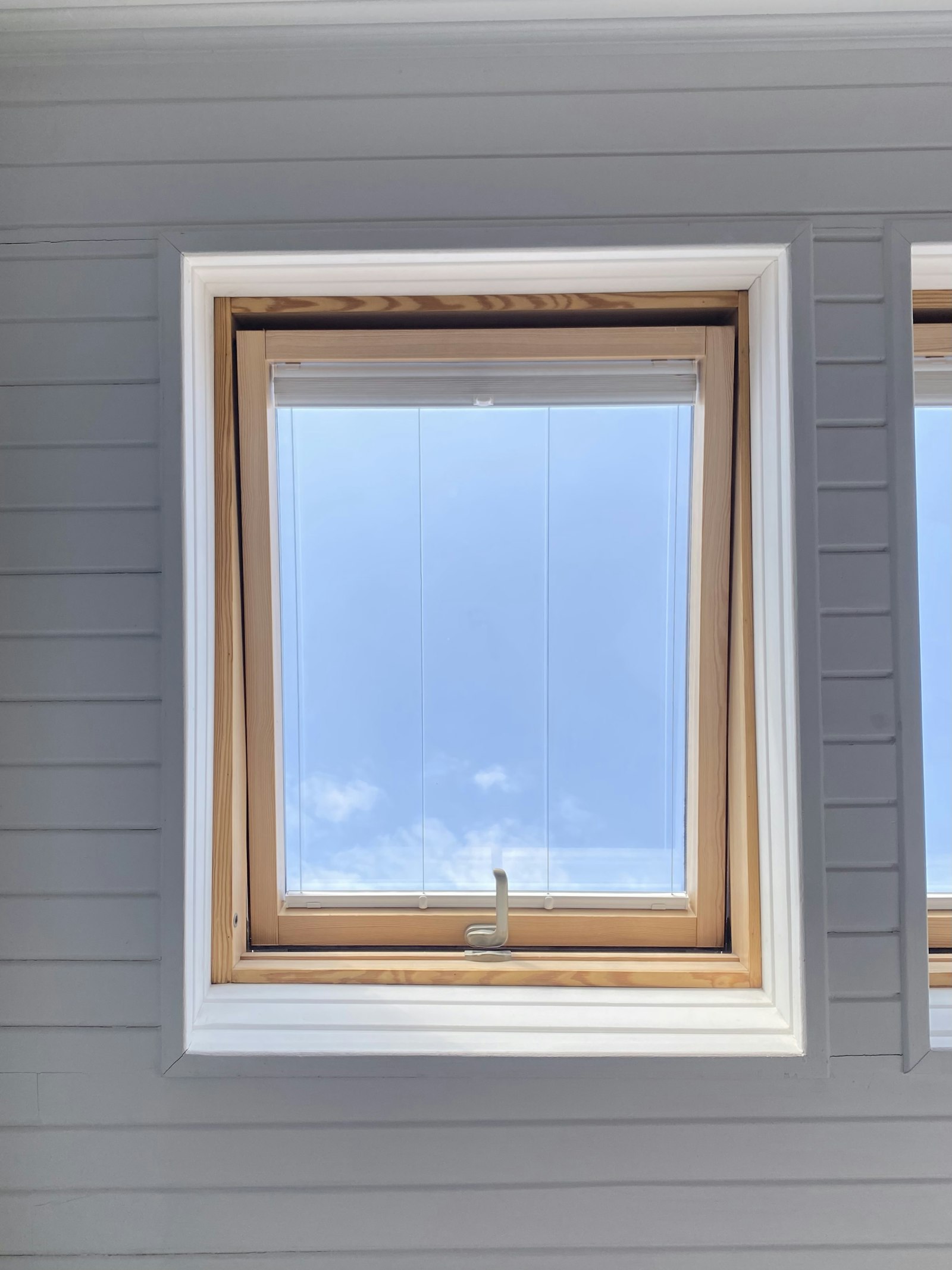 New window frame set into a bare rough opening
