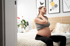 Pregnant woman receiving prenatal chiropractic care for neck pain relief.