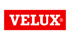 Das Velux-Logo zeigt den weißen Markenschriftzug in einer Serifenschrift auf einem rechteckigen roten Hintergrund.