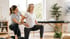 Therapist helps an elder lunge, focusing on pelvic floor stability.
