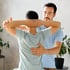 A chiropractor adjusts a patient's neck and upper back as part of their physical rehabilitation program.