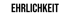 Schwarzer Text „EHRLICHKEIT“ auf dunkelgrünem Hintergrund.
