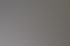 Innenansicht eines Mazda-Autohauses mit beleuchteten Mazda-Logos an der Wand und einem Katalog auf dem Schreibtisch.