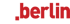 Logo von tv.berlin mit weißem "tv." und rotem ".berlin" auf dunkelgrünem Hintergrund.