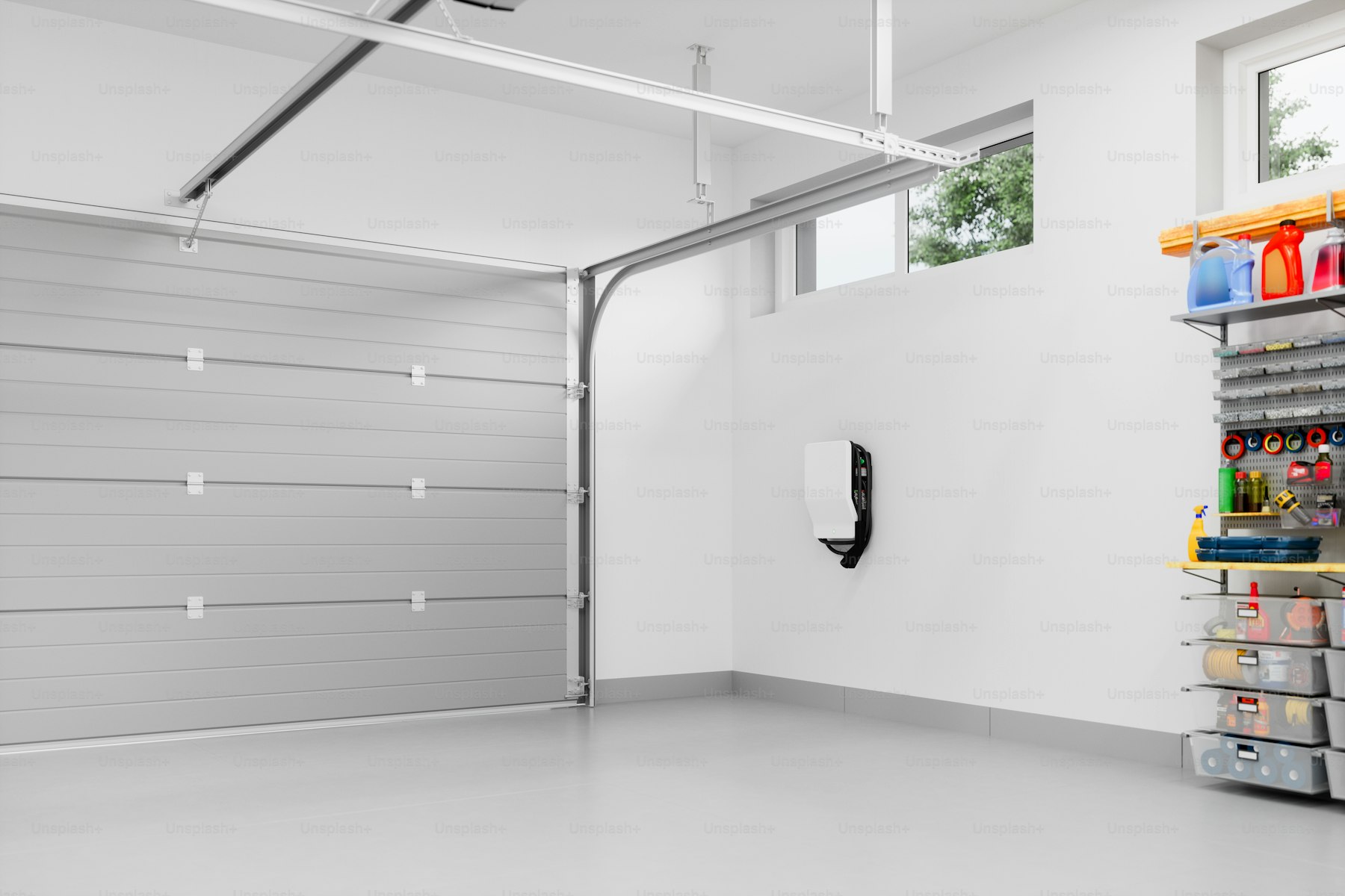 Modern residential garage fitted with a wall-mounted EV charging station