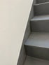 PU-Beschichtung einer Treppe mit grauer Betonoptik