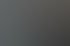 Nahaufnahme einer glänzenden, weißen Schweißnaht auf einer dunklen Metalloberfläche.
