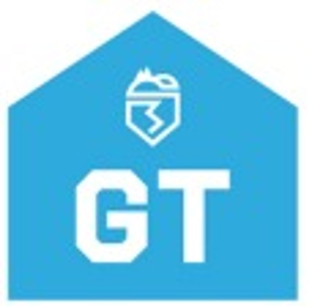 Blaues Haus-Symbol mit weißem "GT"-Text und einem Wappen mit Mütze und Blitz.