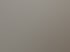 Modernes Badezimmer im Dachgeschoss mit grauen Fliesen, Dachfenster und weißen Schrägen während der Sanierung.