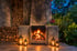 Honeymoon suite with a lit fireplace at dusk, Five Volcanoes Boutique Hotel, Rwanda