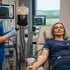 Woman giving blood, undergoing EBOO therapy.