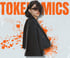Woman with short dark hair and sunglasses, wearing a black blazer, standing in front of orange "TOKENOMICS" text.