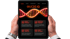 Hands holding a tablet displaying "GUIDE IQ" above a glowing DNA strand and four strategy boxes.