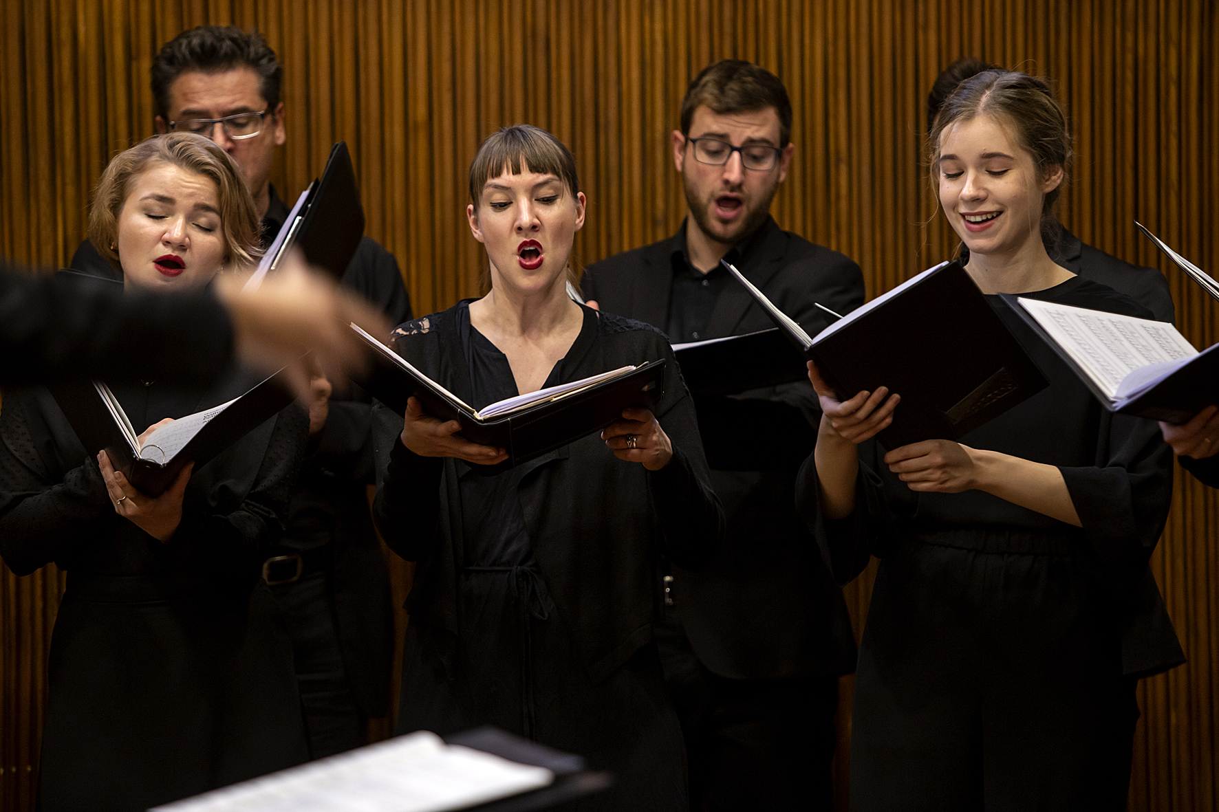 A masterclass participant conducting the closing concert choir, Voices of Spirit 2018, Graz