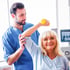 Therapist assisting stroke patient with rehabilitation exercises