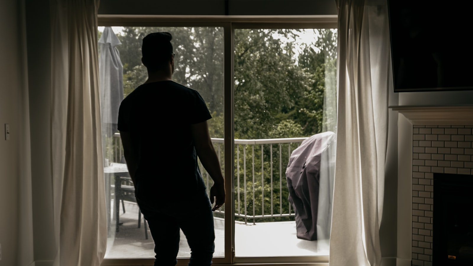 Installer standing at a large replacement window