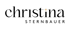Ein kleiner, vierzackiger goldener Stern leuchtet auf einem schwarzen Hintergrund.