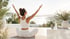 Woman in white attire doing yoga to improve wellness