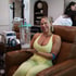 Woman receiving EBOO therapy in a wellness clinic, relaxed during treatment