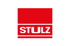 Rotes Quadrat mit weißem "STULZ"-Schriftzug und einer weißen Linie darunter.