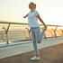 Woman stretching on a bridge after succesful Umbilical Cord Tissue Therapy.