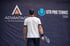 Tennis player in front of Advantage Sports Management UTR PTT banner