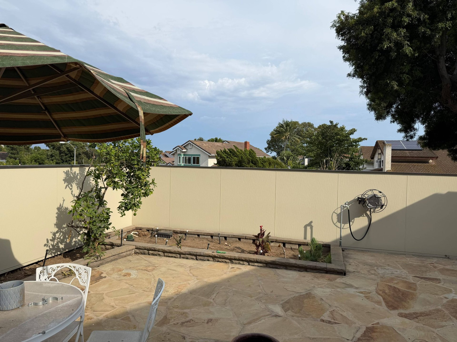 Finished Hardie panel fence adding privacy to a San Diego backyard patio