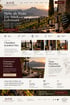 Website-Layout des Weinguts Castello Veritas mit Weinbergen, Weinflaschen und Text zur Weinkultur bei Sonnenuntergang.