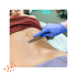 Practitioner using Graston tool on patient’s back