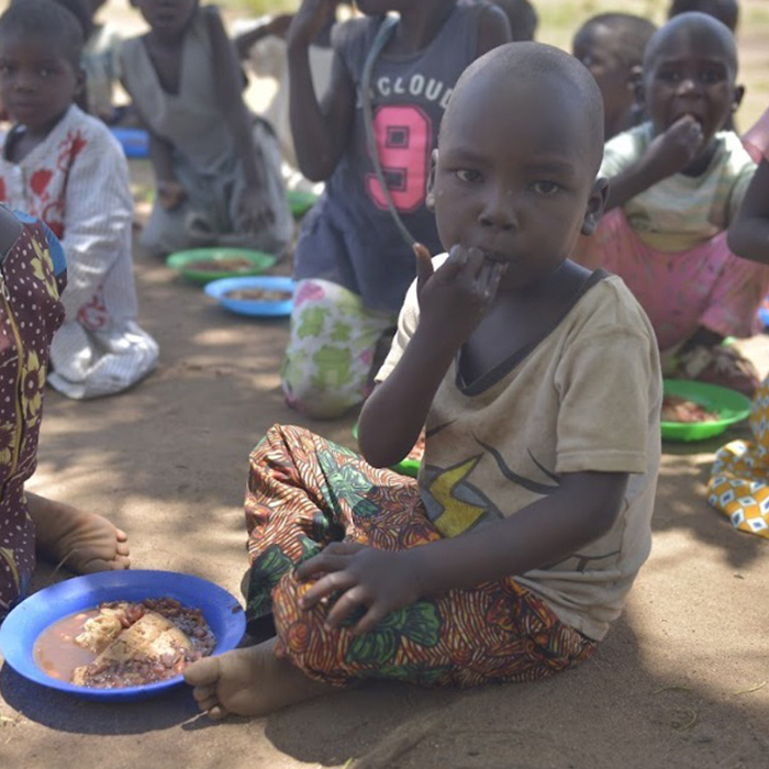 charity workers distributing aid packages to families in need, professional photography