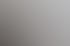 Drei Frauen betrachten Baupläne an einer weißen Wand.