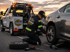 owing Eastvale flat tire change service replacing a damaged tire with professional roadside assistance at sunset