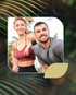A smiling, athletic man and woman posing together outdoors.