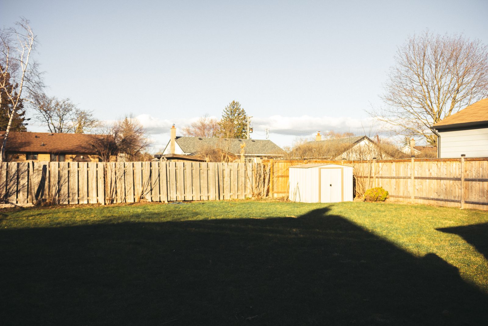 Wood privacy fence around a residential back yard