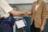 male-plumber-working-with-client-fix-kitchen-problems