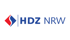 Logo des HDZ NRW mit einer rot-blauen Raute und blauem Schriftzug auf weißem Hintergrund.